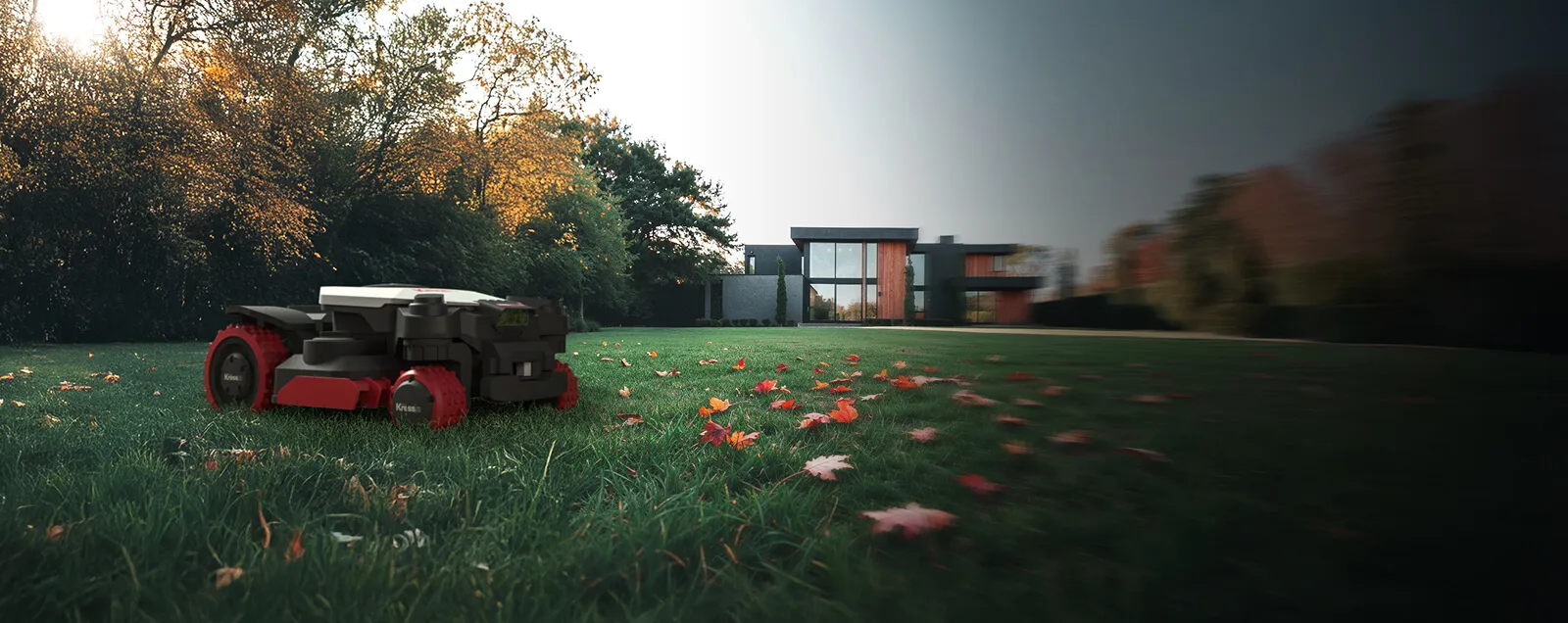 Robot Kress tondant une pelouse couverte de feuilles mortes